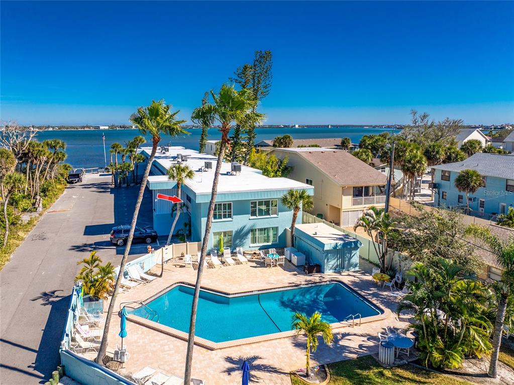 5055 North Beach Road, Unit 208 Englewood, FL 34223 - Photo 6 of 43 a view of a chairs and table in patio