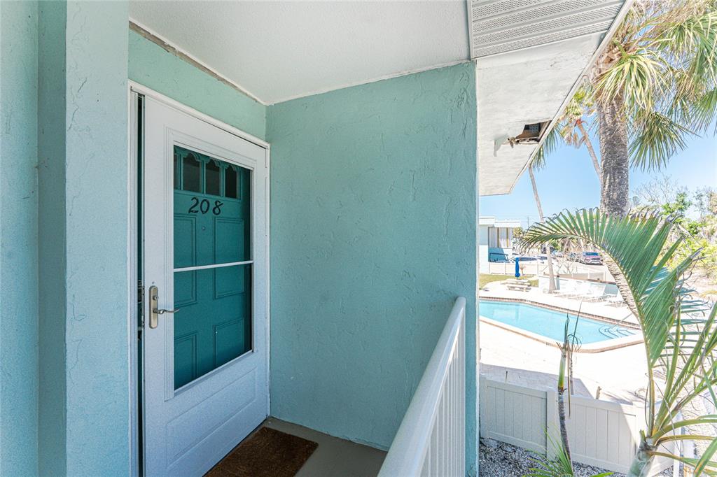 5055 North Beach Road, Unit 208 Englewood, FL 34223 - Photo 7 of 43 a view of balcony with a potted plant