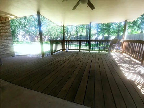 a view of balcony with wooden floor