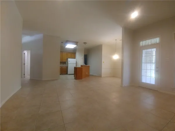 a view of a big room with windows and cabinet