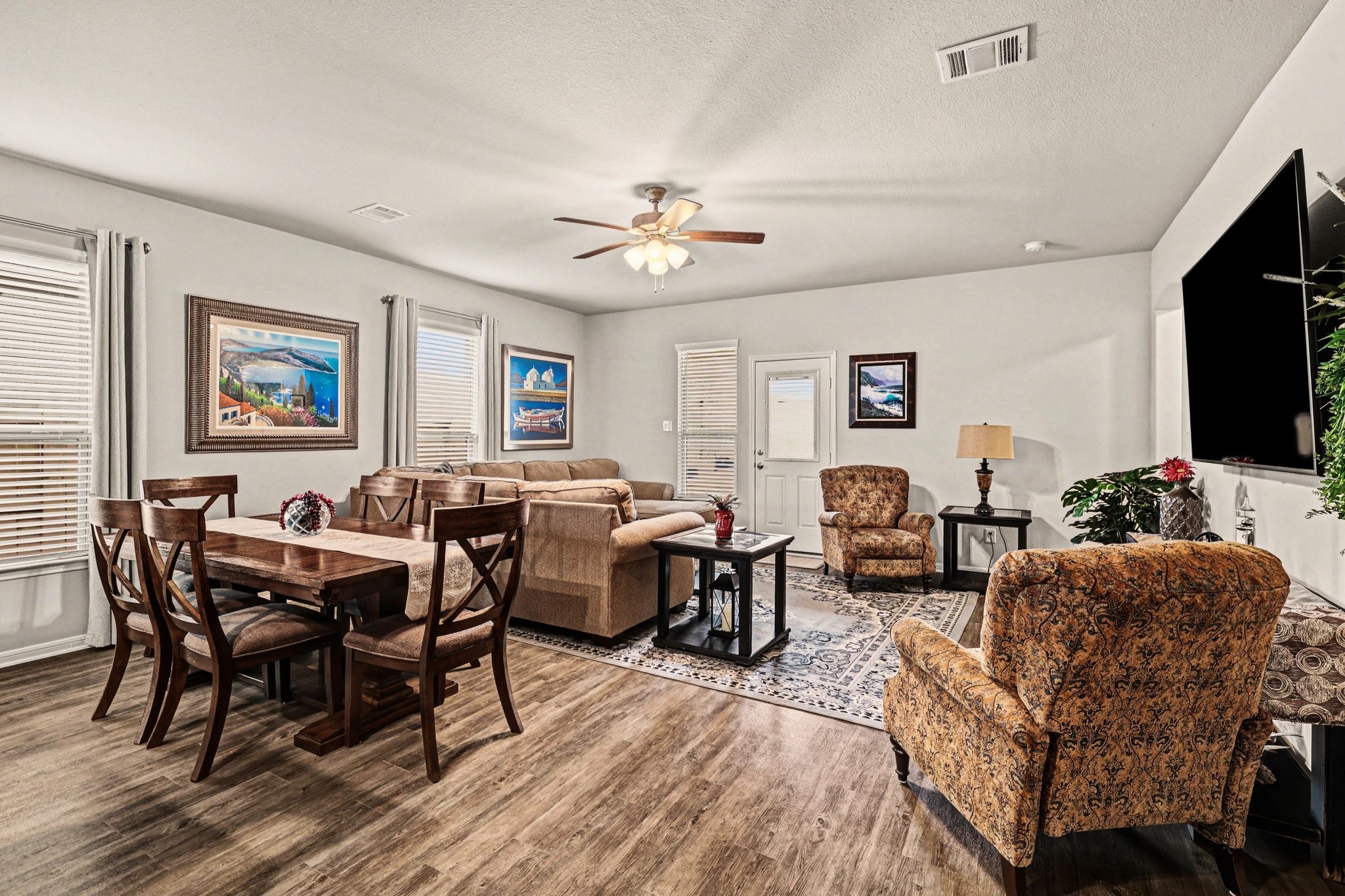 320 Red Maple Lane Conroe, TX 77304 - Photo 9 of 24 Bright great room with natural light, custom blinds, and privacy blackout curtains included.