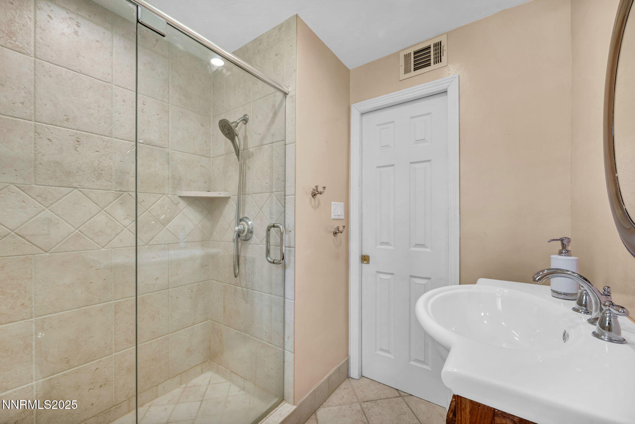 825 West 11th Street Reno, NV 89503 - Photo 9 of 26 a bathroom with a sink a toilet and shower