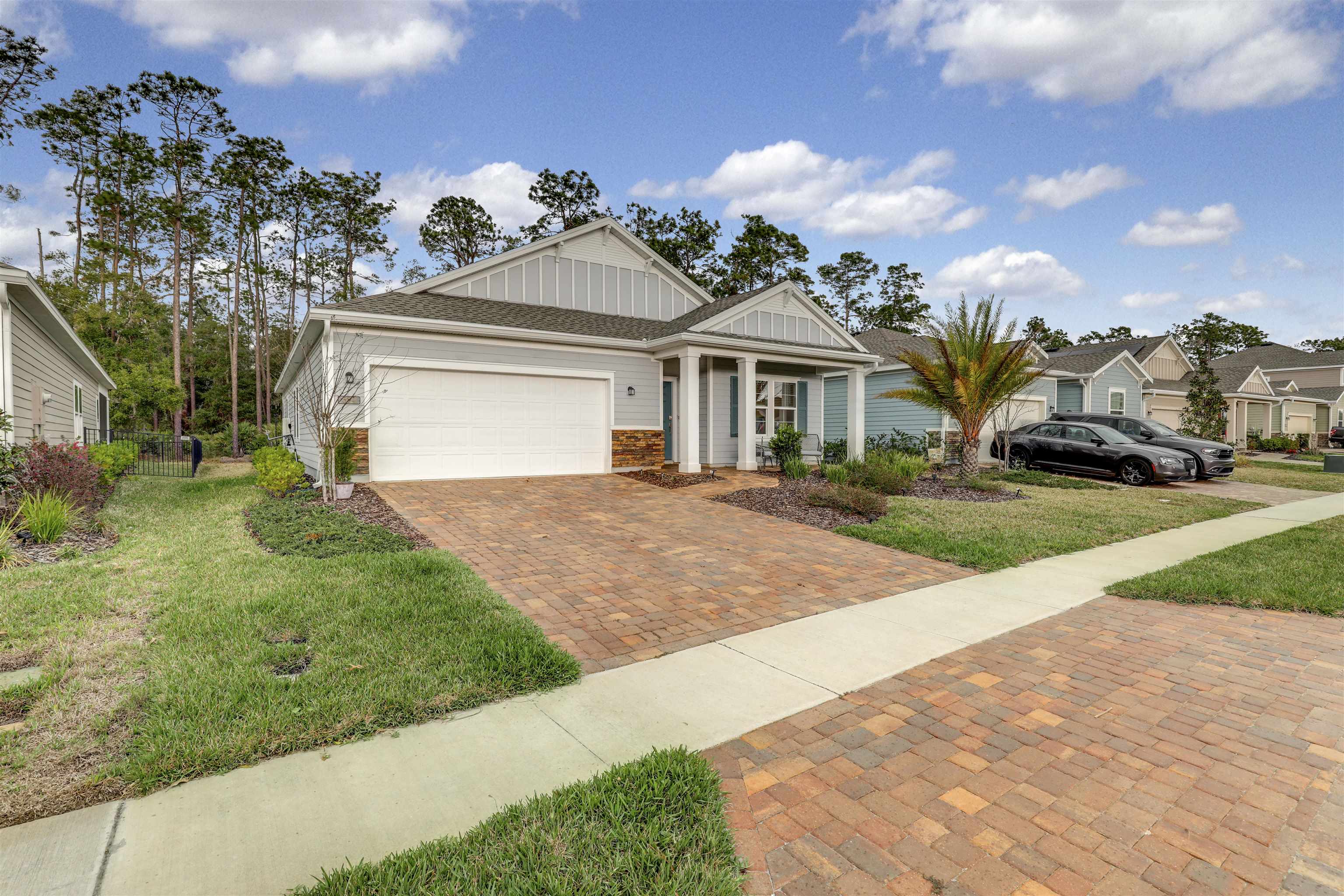 384 Gan Way St. Johns, FL 32259 - Photo 1 of 61 a front view of a house with a garden and yard
