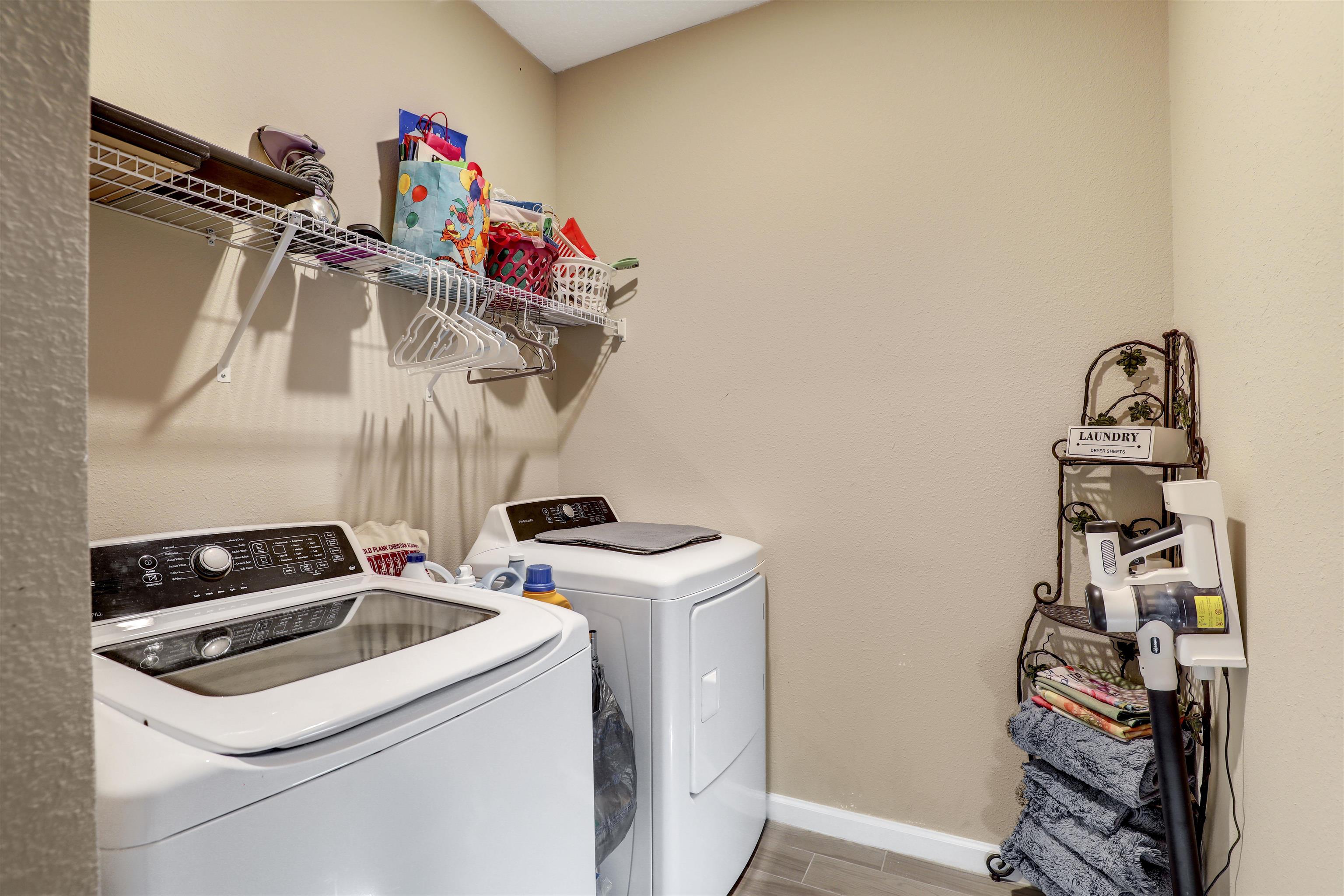 384 Gan Way St. Johns, FL 32259 - Photo 14 of 61 a utility room with dryer washer and other items