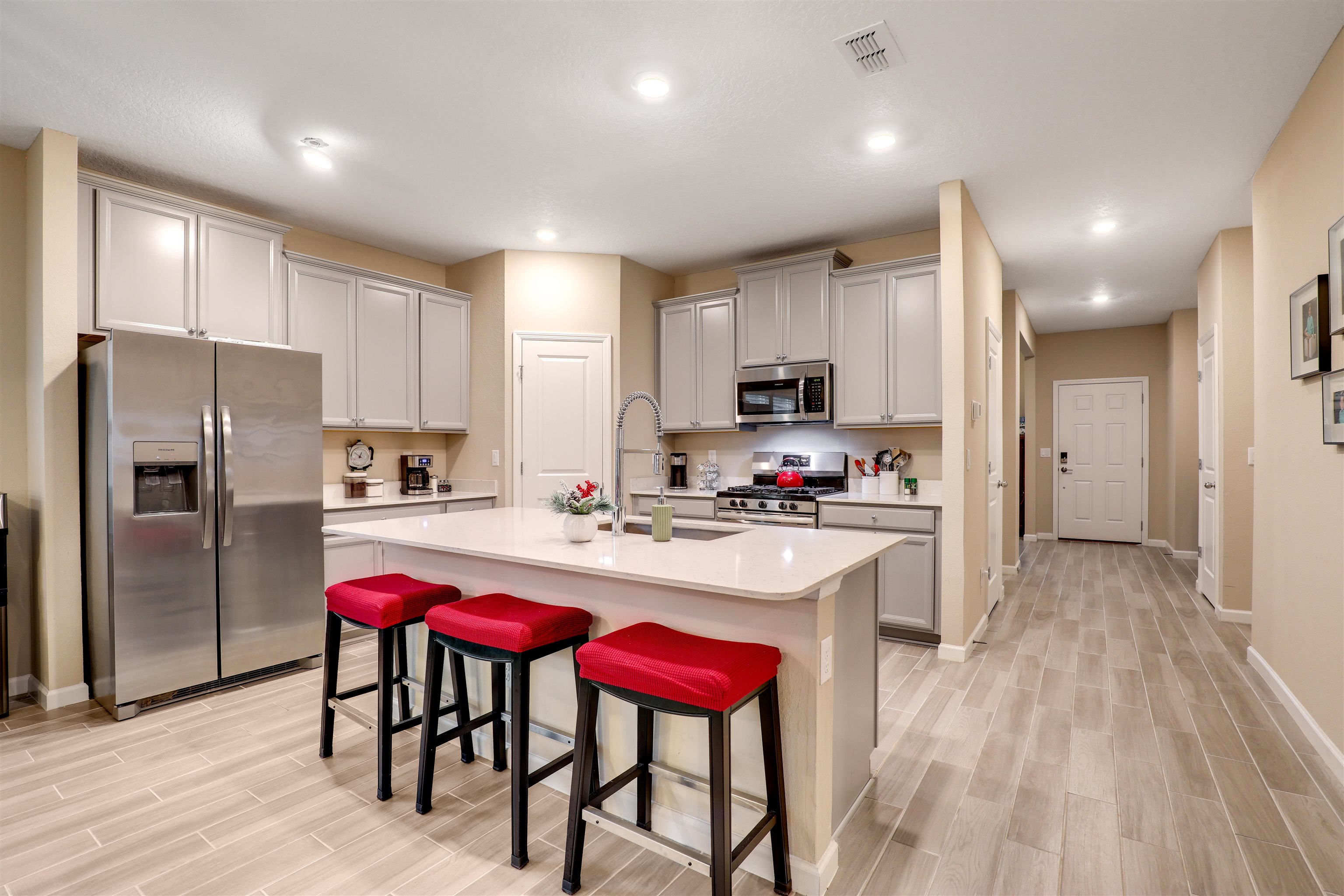 384 Gan Way St. Johns, FL 32259 - Photo 15 of 61 a kitchen with stainless steel appliances a dining table chairs refrigerator and microwave