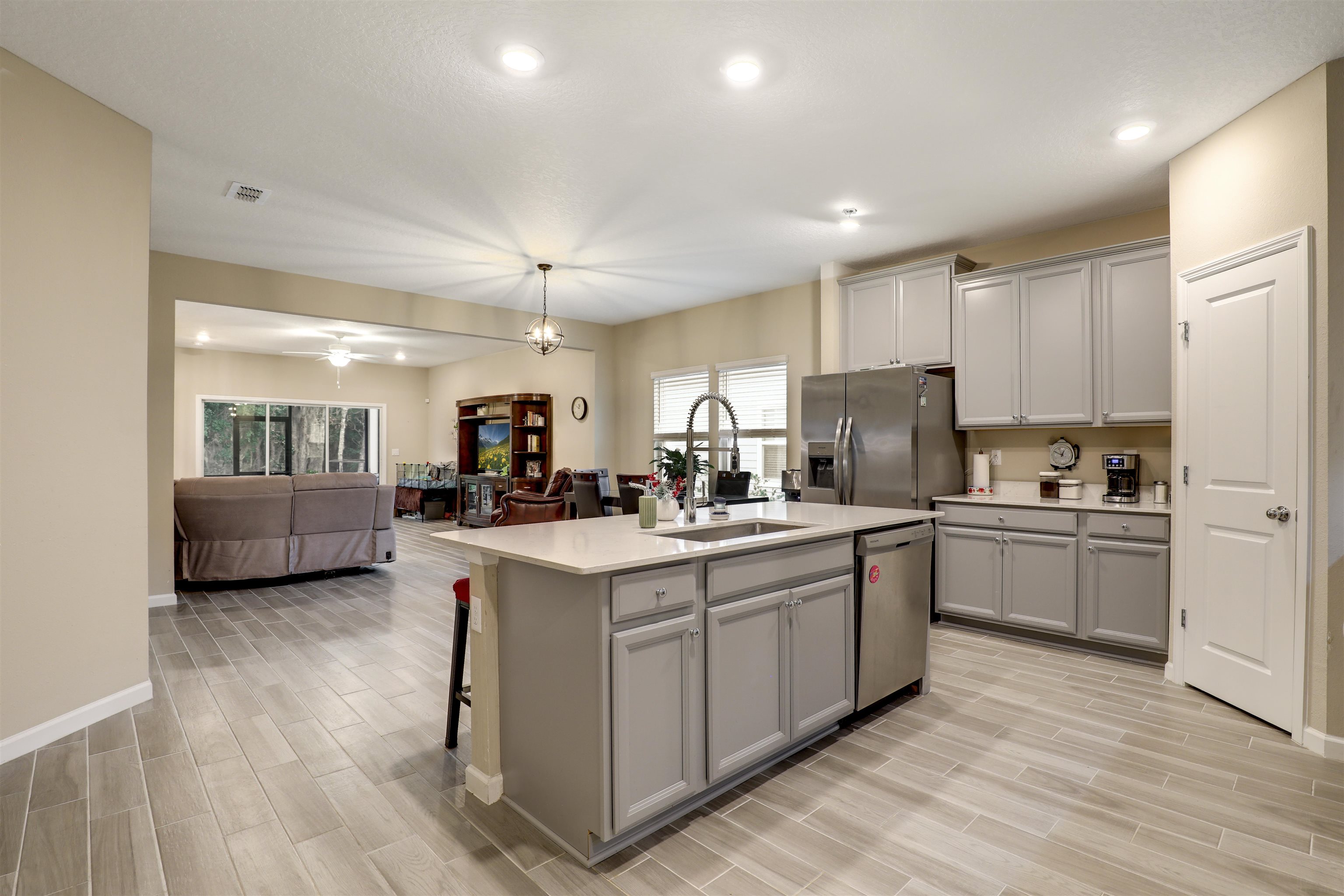 384 Gan Way St. Johns, FL 32259 - Photo 2 of 61 a kitchen with a sink cabinets and wooden floor