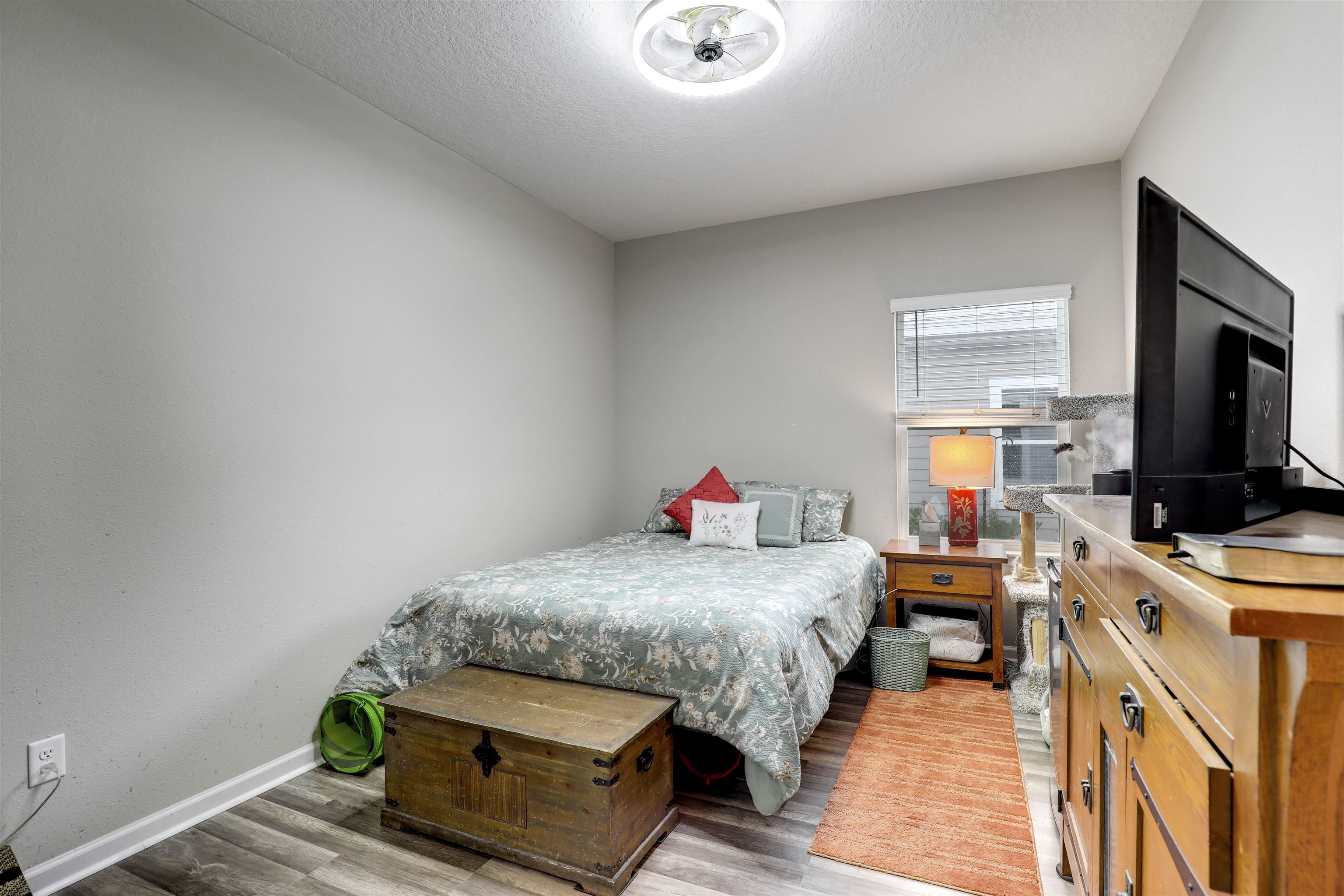 384 Gan Way St. Johns, FL 32259 - Photo 23 of 61 a bedroom with a bed and a flat screen tv