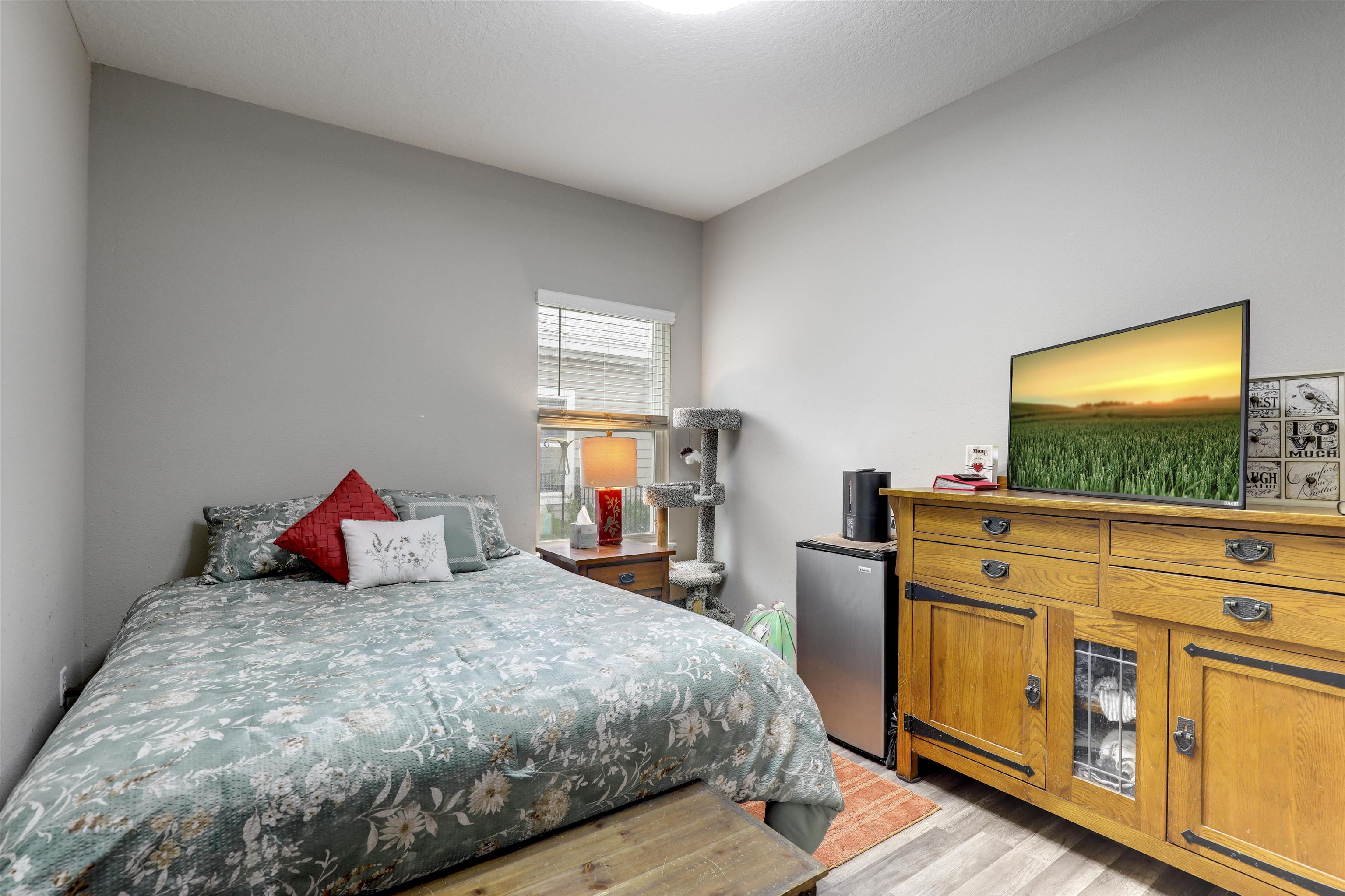 384 Gan Way St. Johns, FL 32259 - Photo 24 of 61 a bedroom with a bed and a flat screen tv