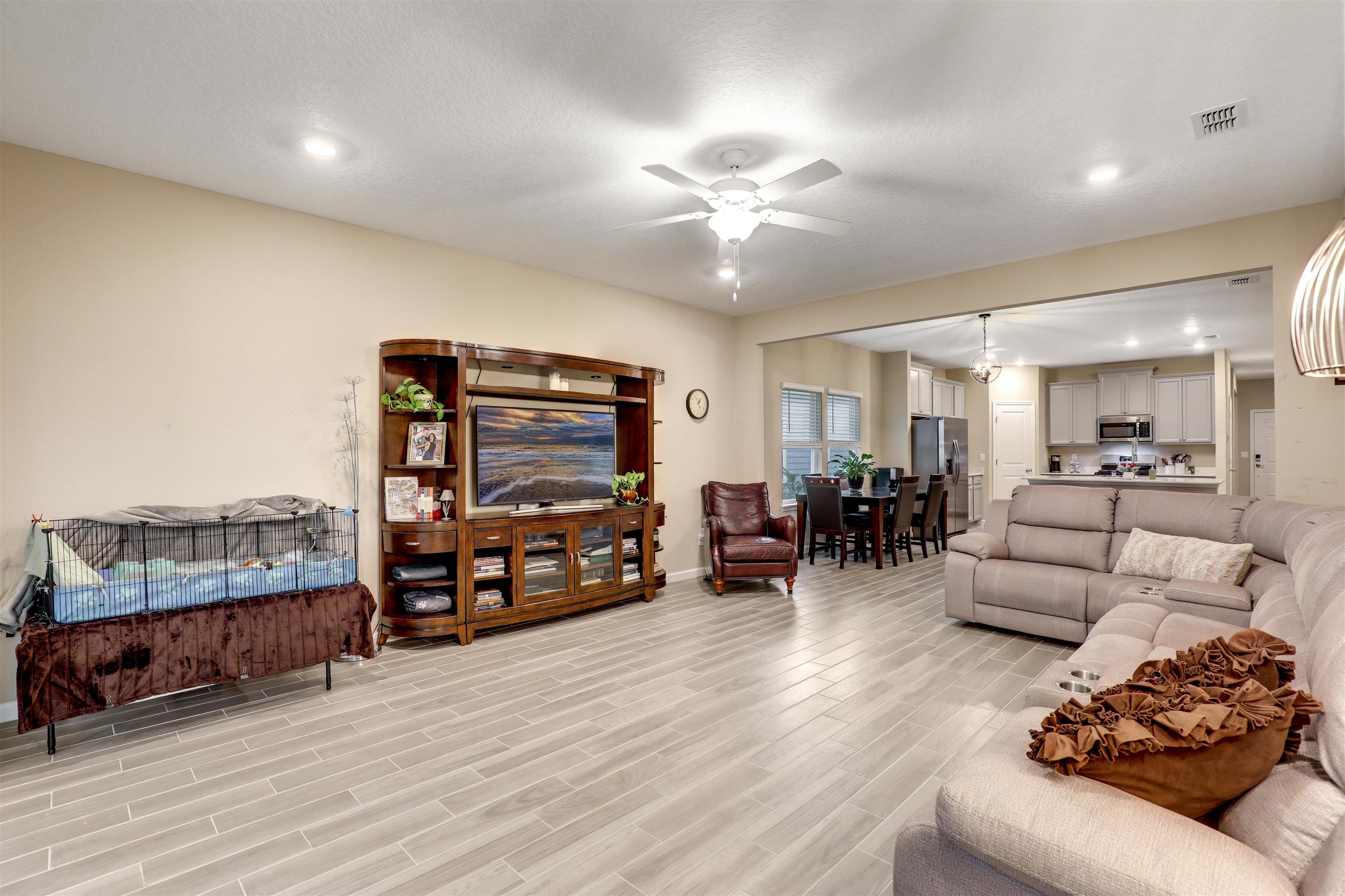 384 Gan Way St. Johns, FL 32259 - Photo 31 of 61 a living room with furniture and a flat screen tv