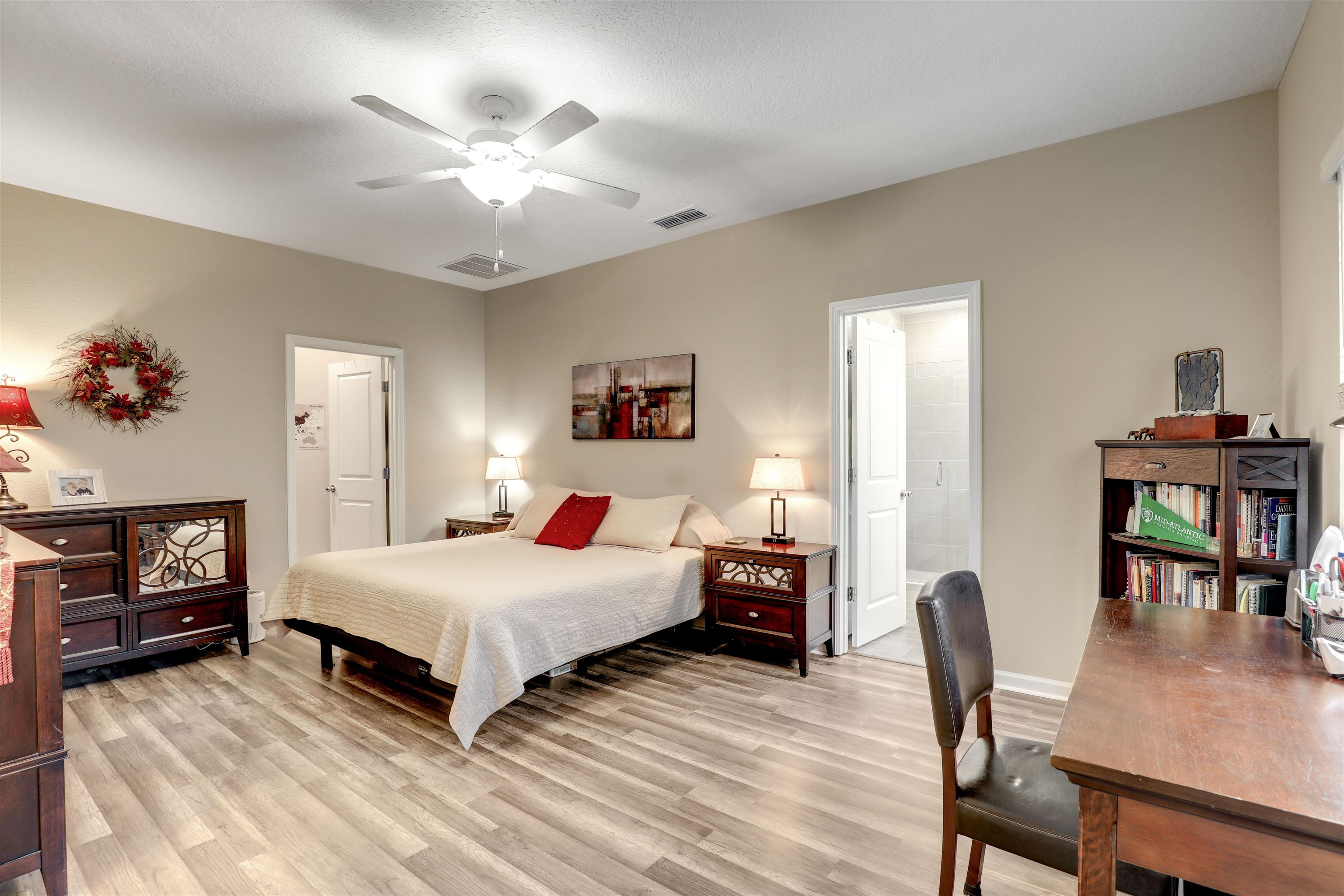 384 Gan Way St. Johns, FL 32259 - Photo 32 of 61 a bedroom with a bed and a table in it