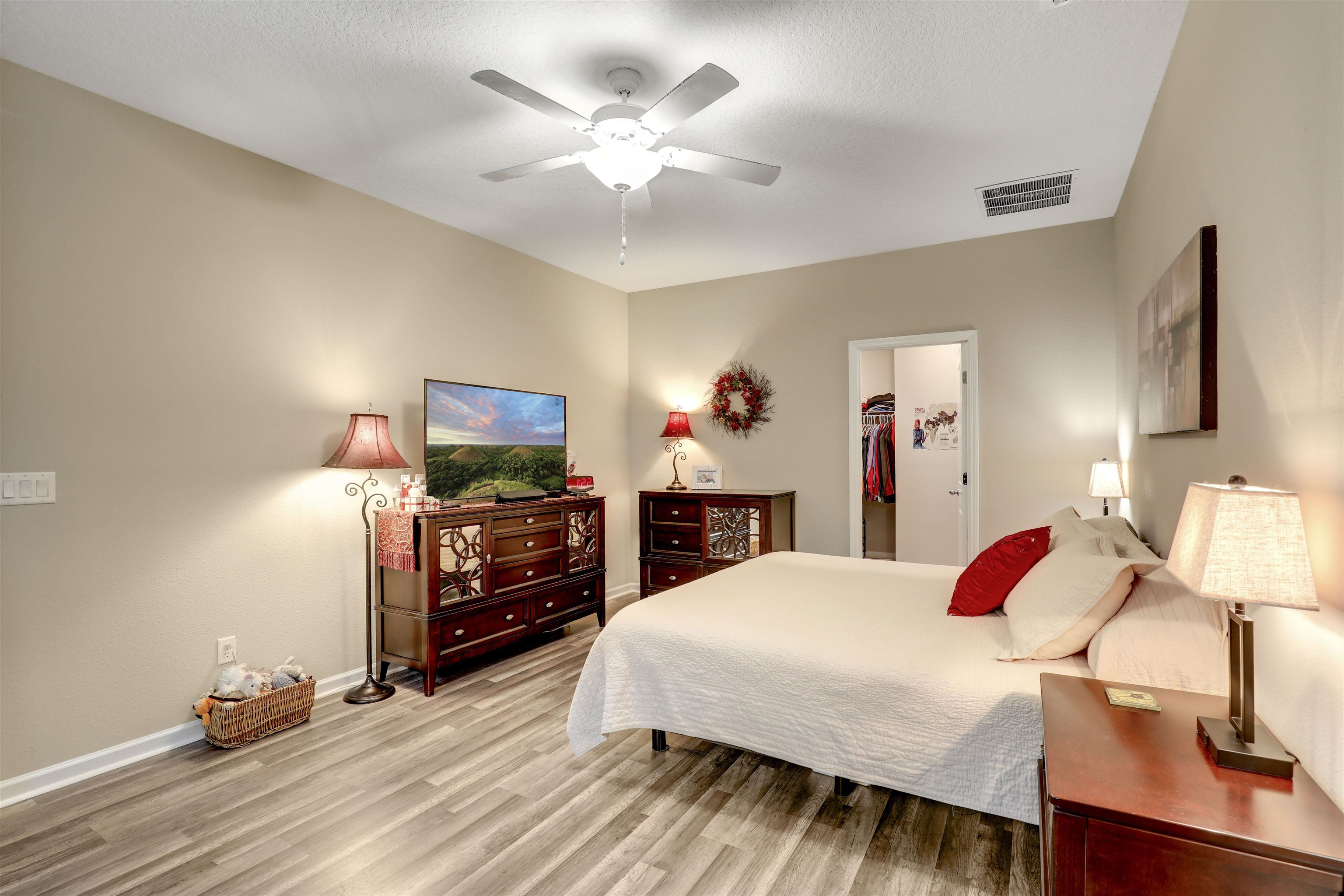 384 Gan Way St. Johns, FL 32259 - Photo 33 of 61 a bedroom with a bed and wooden floor