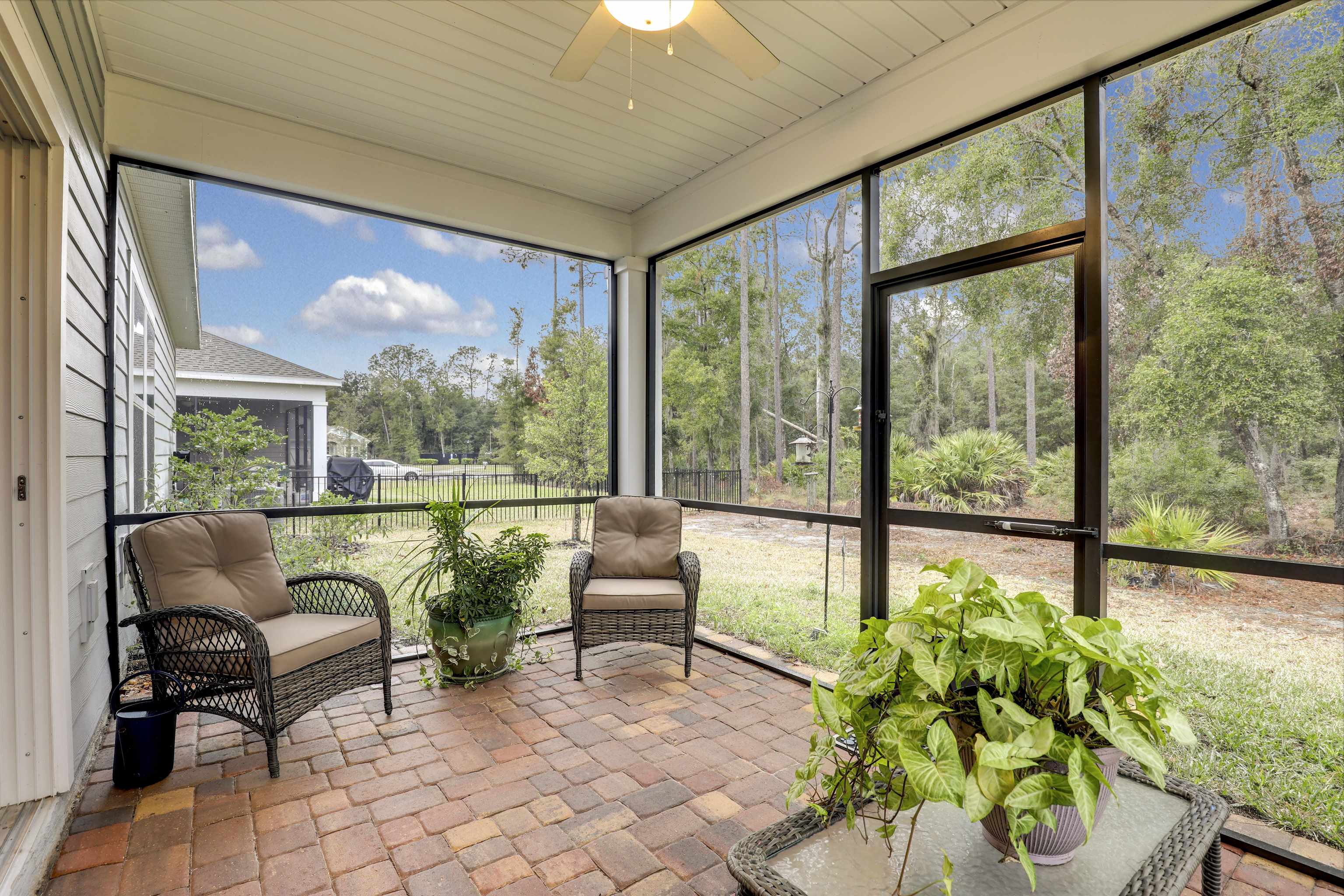 384 Gan Way St. Johns, FL 32259 - Photo 39 of 61 a living room filled with furniture and a large window