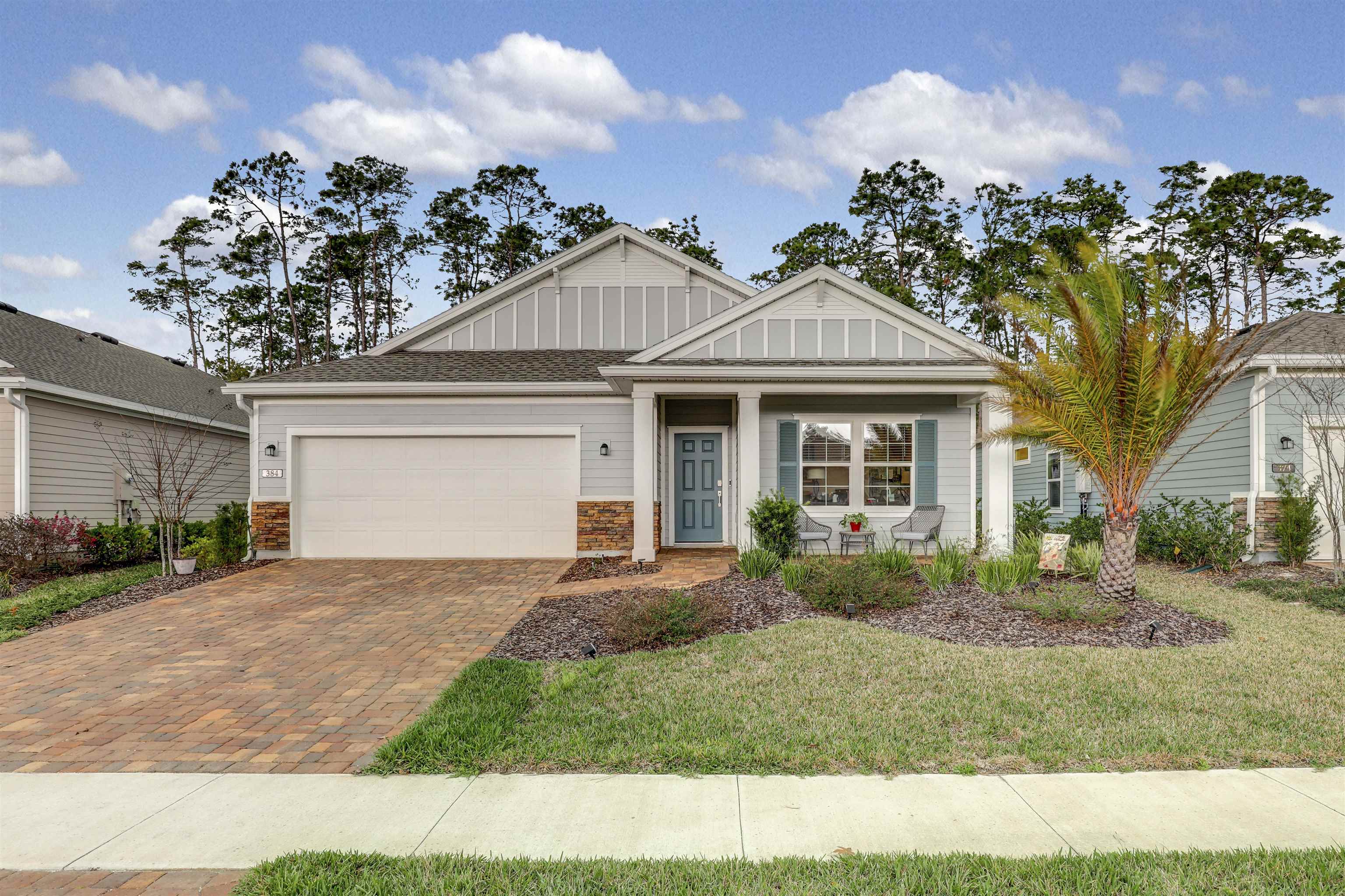 384 Gan Way St. Johns, FL 32259 - Photo 61 of 61 a front view of a house with garden