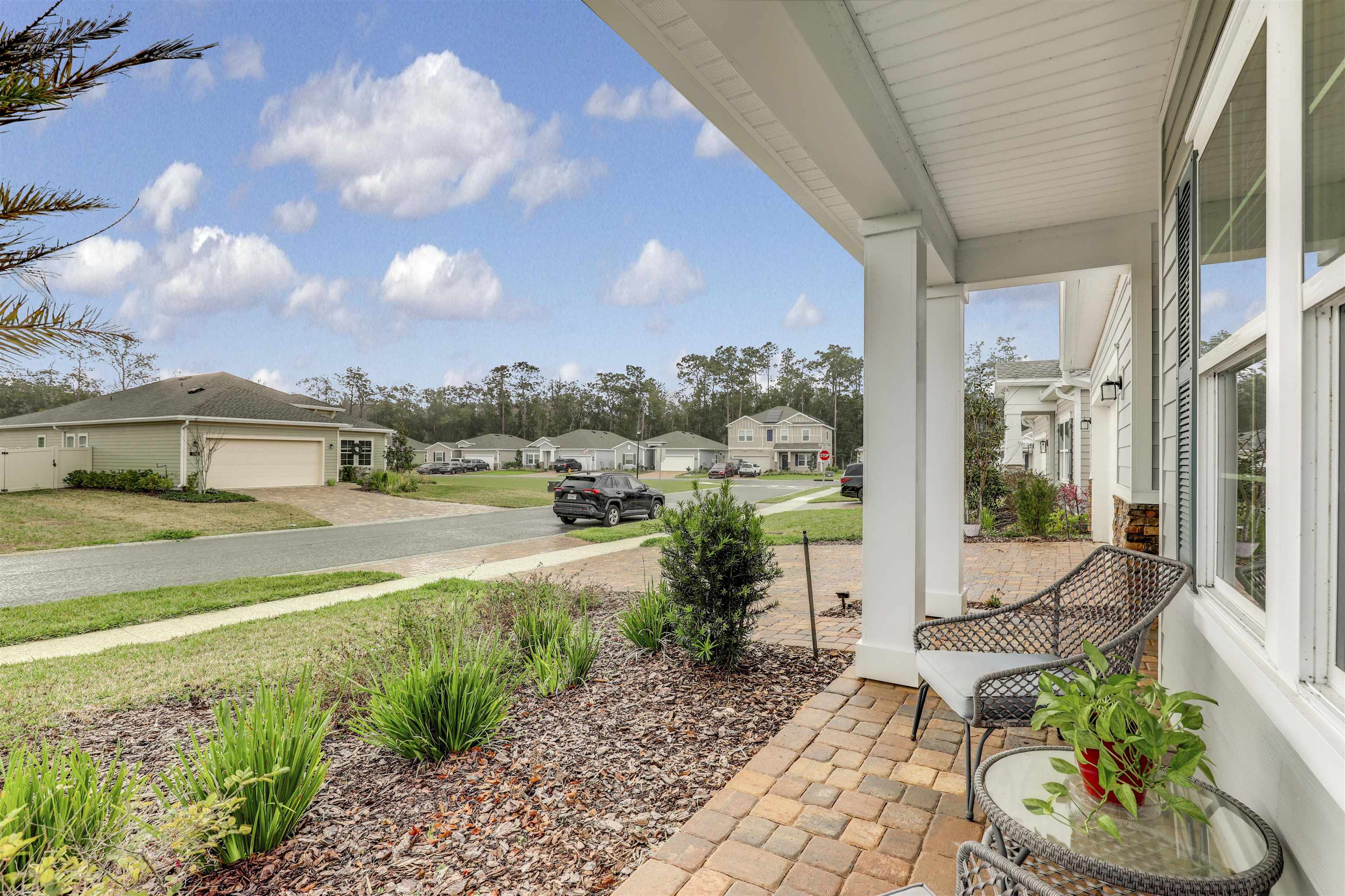 384 Gan Way St. Johns, FL 32259 - Photo 7 of 61 a view of a patio with table and chairs potted plants