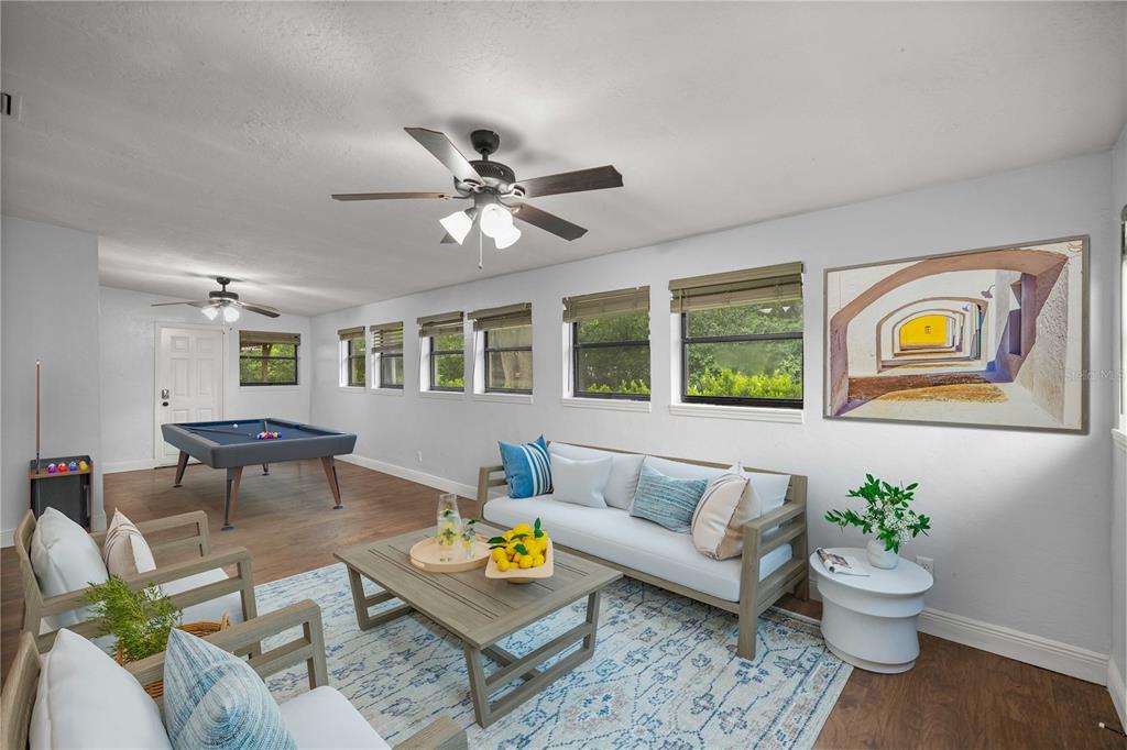 10500 Southwest 74th Court Ocala, FL 34476 - Photo 15 of 28 a living room with furniture and wooden floor