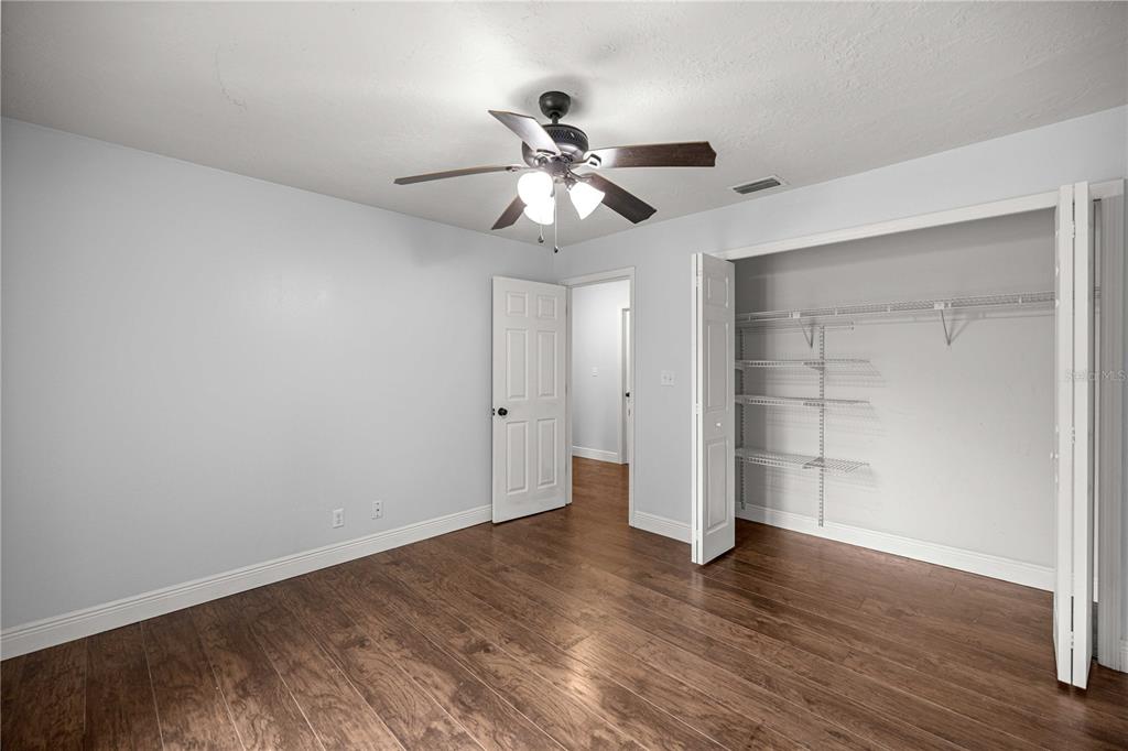 10500 Southwest 74th Court Ocala, FL 34476 - Photo 16 of 28 a view of an empty room and wooden floor