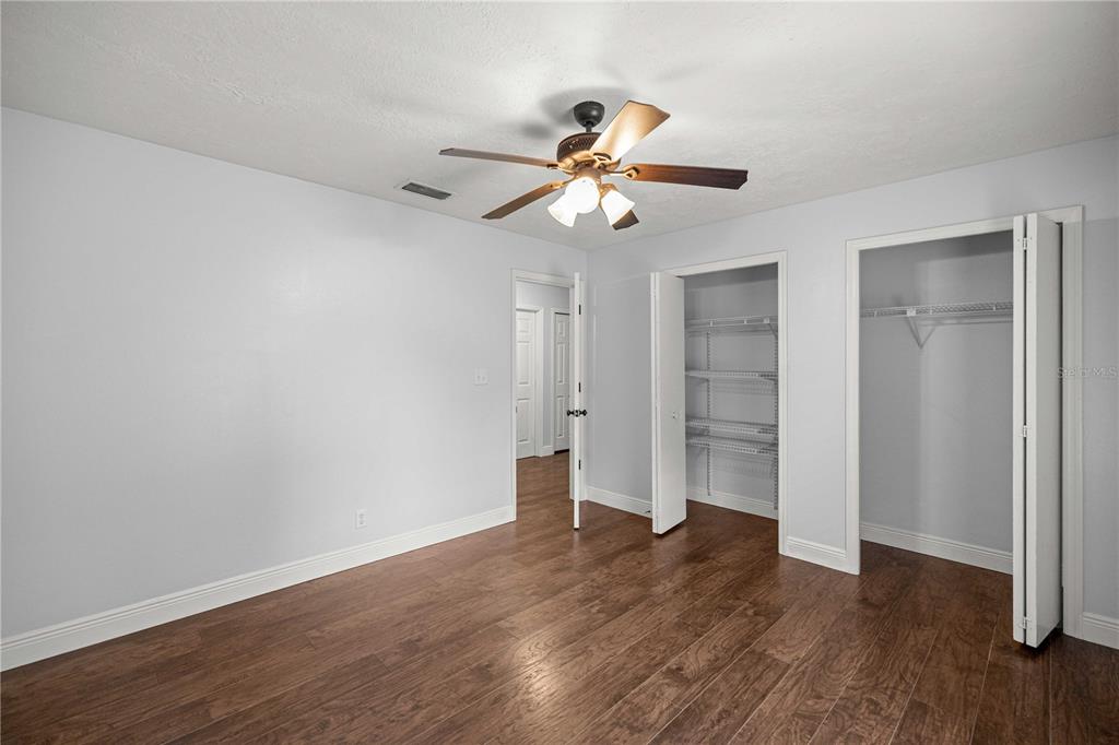 10500 Southwest 74th Court Ocala, FL 34476 - Photo 17 of 28 a view of an empty room and wooden floor