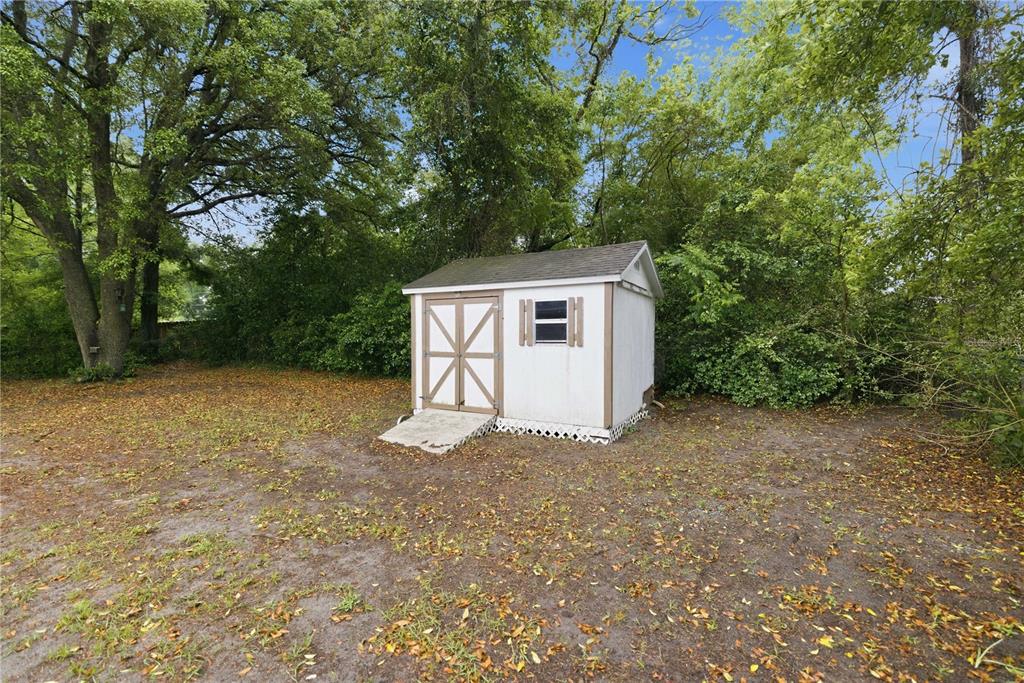 10500 Southwest 74th Court Ocala, FL 34476 - Photo 25 of 28 a view of a house with a yard and garage