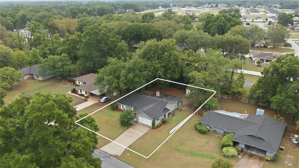 10500 Southwest 74th Court Ocala, FL 34476 - Photo 3 of 28 an aerial view of house with yard