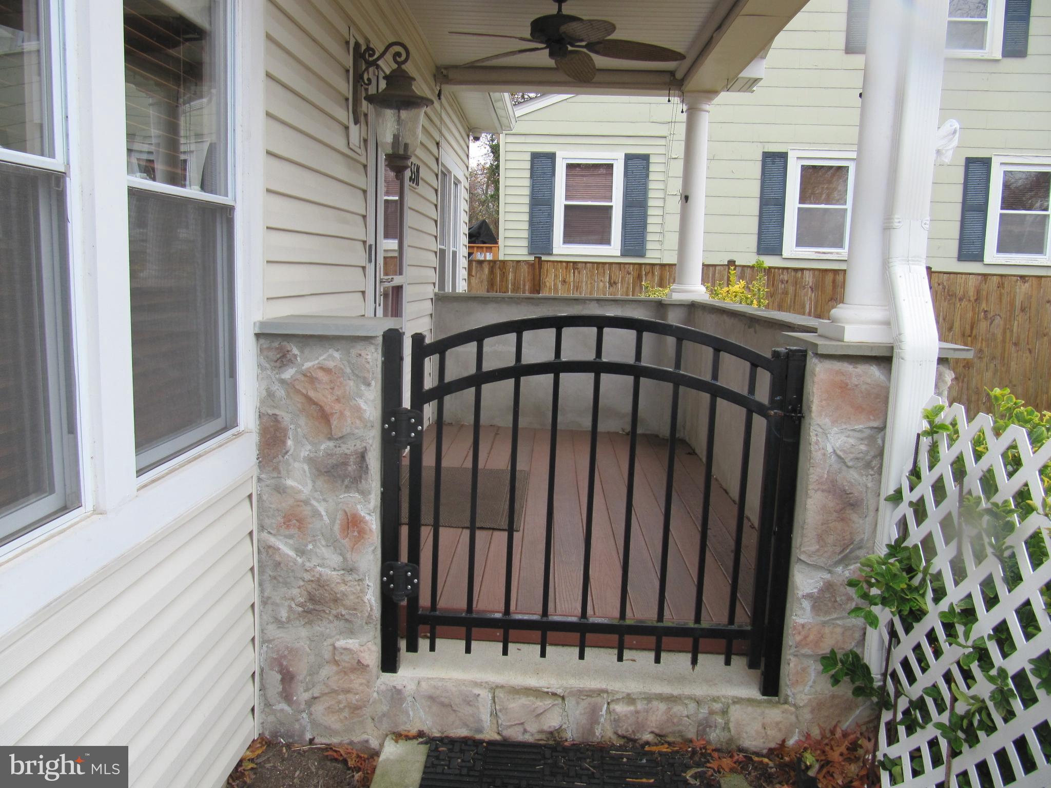 5511 Taylor Road Riverdale, MD 20737 - Photo 3 of 35 Front porch with gate and fan
