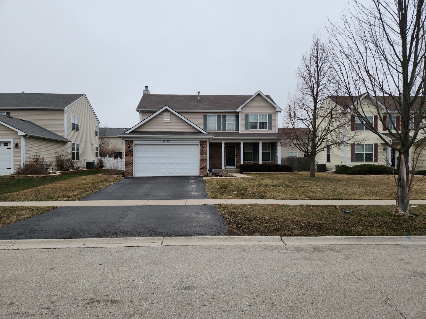 6509 Roth Drive Joliet, IL 60431 - Photo 1 of 10 a front view of a house with a yard