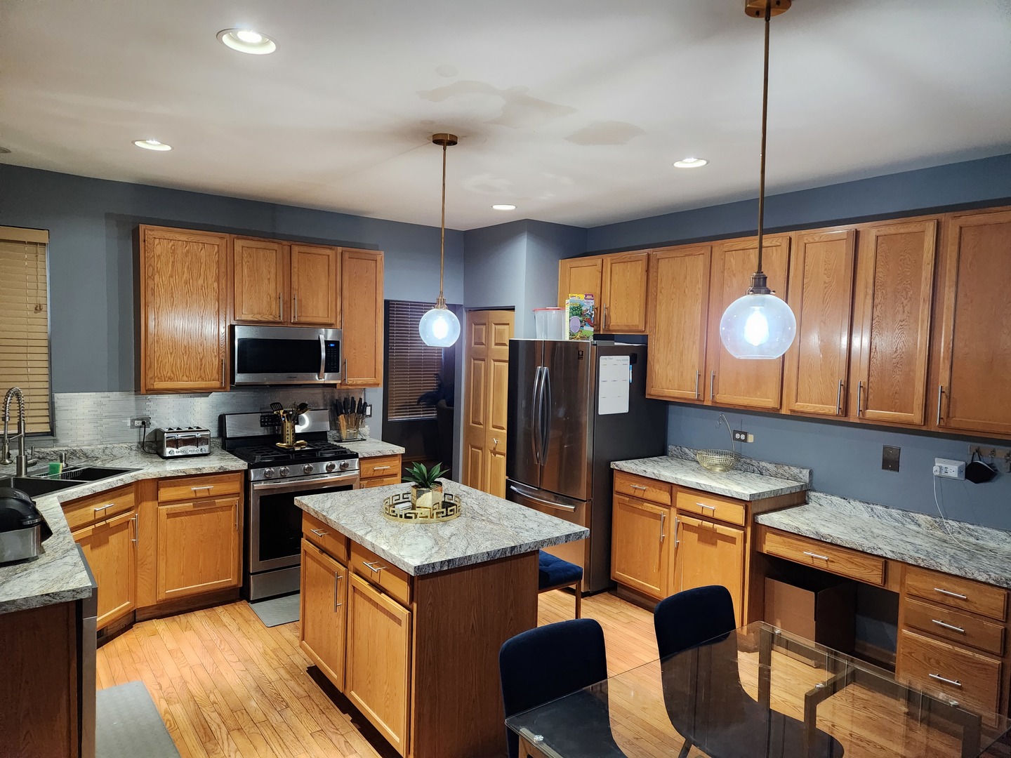 6509 Roth Drive Joliet, IL 60431 - Photo 6 of 10 a kitchen with granite countertop a sink a stove and refrigerator