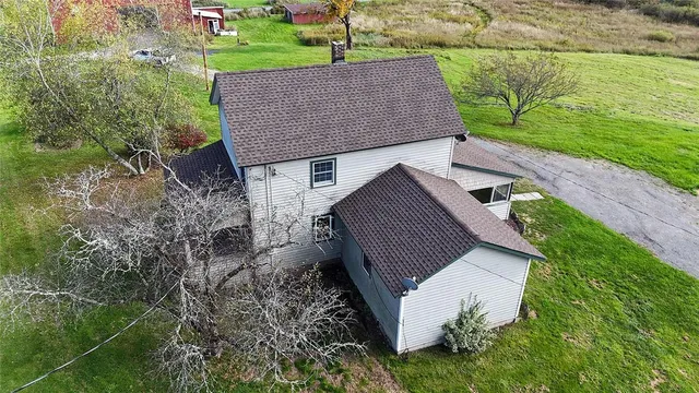 a aerial view of a house with a yard
