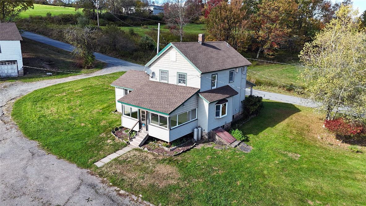 93 Villa Roma Road Callicoon, NY 12723 - Photo 23 of 29 a aerial view of a house with a yard table and chairs