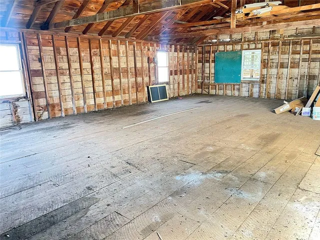 an empty room with entrance door