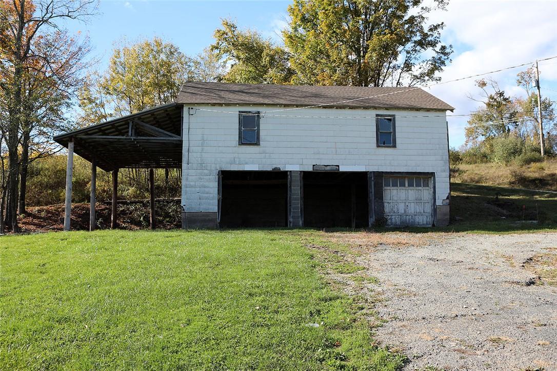 93 Villa Roma Road Callicoon, NY 12723 - Photo 5 of 29 a front view of a house with yard covered in snow
