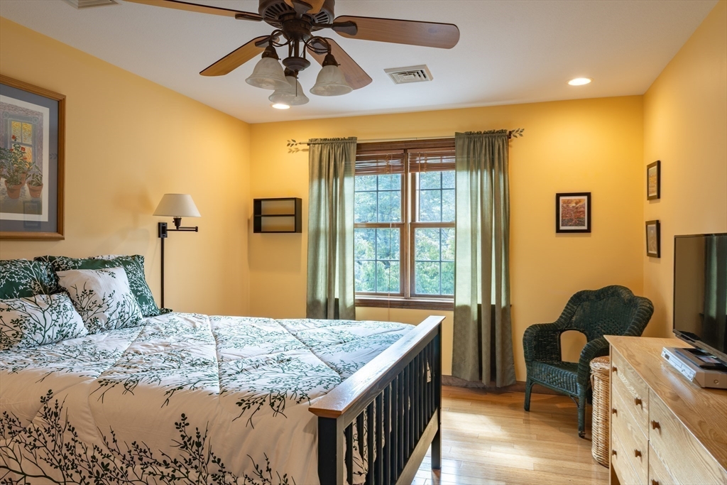 217 Cardinal Way Northampton, MA 01062 - Photo 27 of 37 a bedroom with a bed and wooden floor