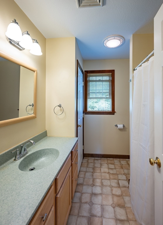 217 Cardinal Way Northampton, MA 01062 - Photo 29 of 37 a bathroom with a sink a vanity and a mirror