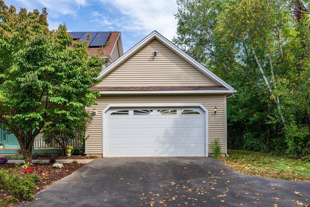 217 Cardinal Way Northampton, MA 01062 - Photo 5 of 37 a front view of a house with a yard and garage