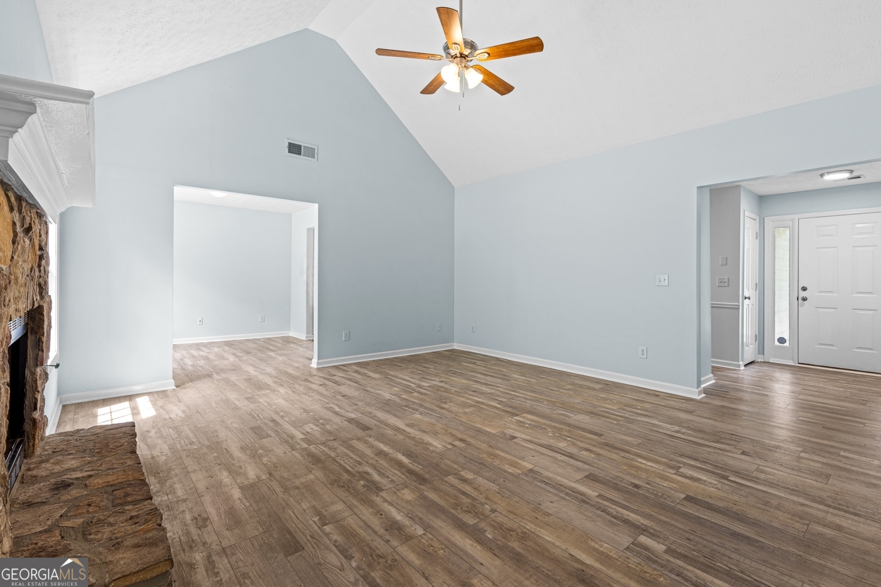484 Creek Crossing Court Grayson, GA 30017 - Photo 7 of 17 a view of empty room with wooden floor and fan