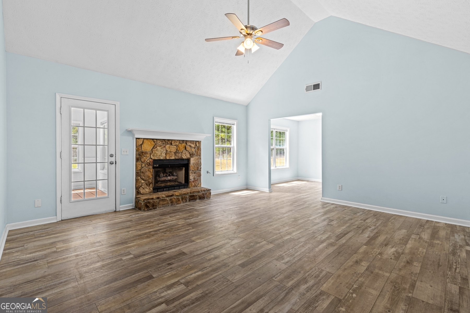 484 Creek Crossing Court Grayson, GA 30017 - Photo 8 of 17 an empty room with windows and fireplace
