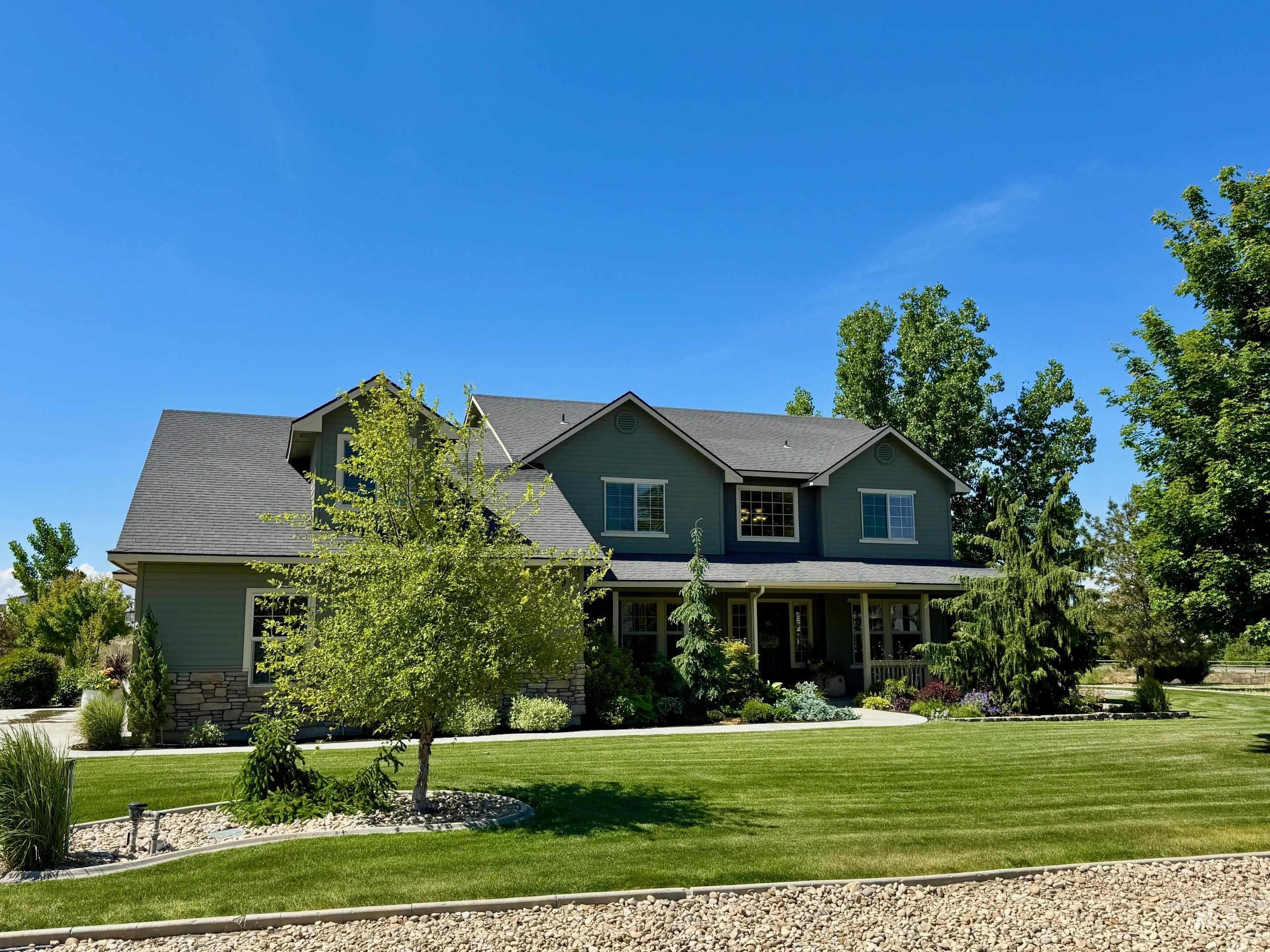 9299 Kemp Road Middleton, ID 83644 - Photo 44 of 50 Two-story residence featuring green siding and stone accents