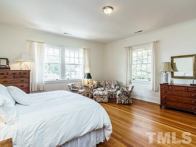 2025 Fairview Road Raleigh, NC 27608 - Photo 16 of 30 a bedroom with a bed and wooden floor