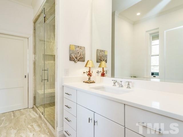2025 Fairview Road Raleigh, NC 27608 - Photo 17 of 30 a bathroom with a sink and a mirror