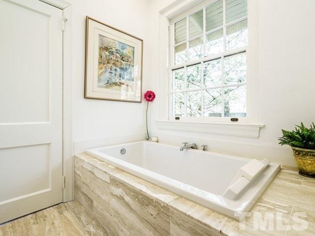 2025 Fairview Road Raleigh, NC 27608 - Photo 18 of 30 a bath tub sitting next to a window