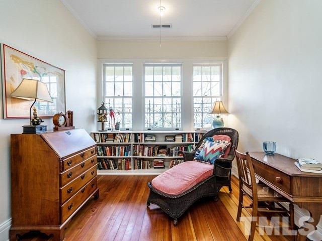 2025 Fairview Road Raleigh, NC 27608 - Photo 24 of 30 a bedroom with furniture and a wooden floor