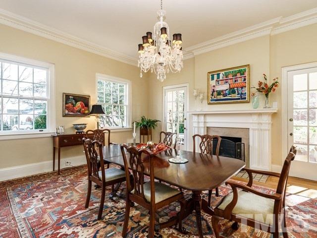 2025 Fairview Road Raleigh, NC 27608 - Photo 10 of 30 a view of a dining room with furniture and a fireplace