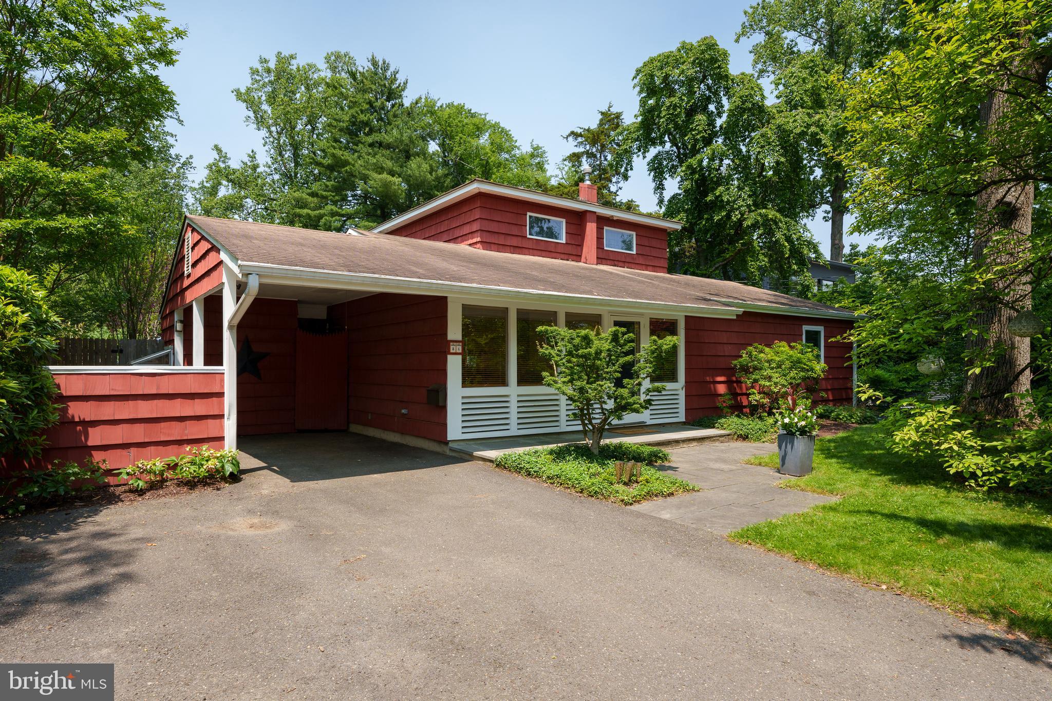 84 Cuyler Road Princeton, NJ 08540 - Photo 2 of 25 a front view of a house with a yard table and chairs