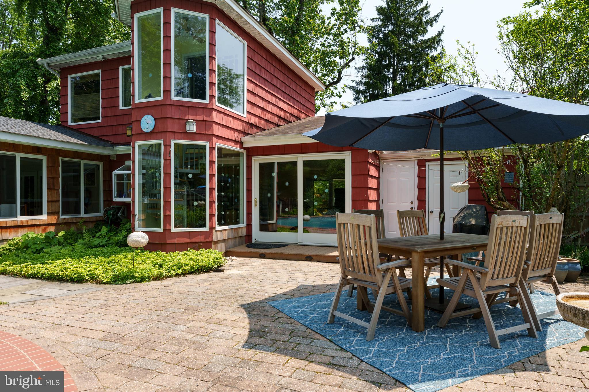 84 Cuyler Road Princeton, NJ 08540 - Photo 23 of 25 a view of a cafe with a table and chairs under an umbrella