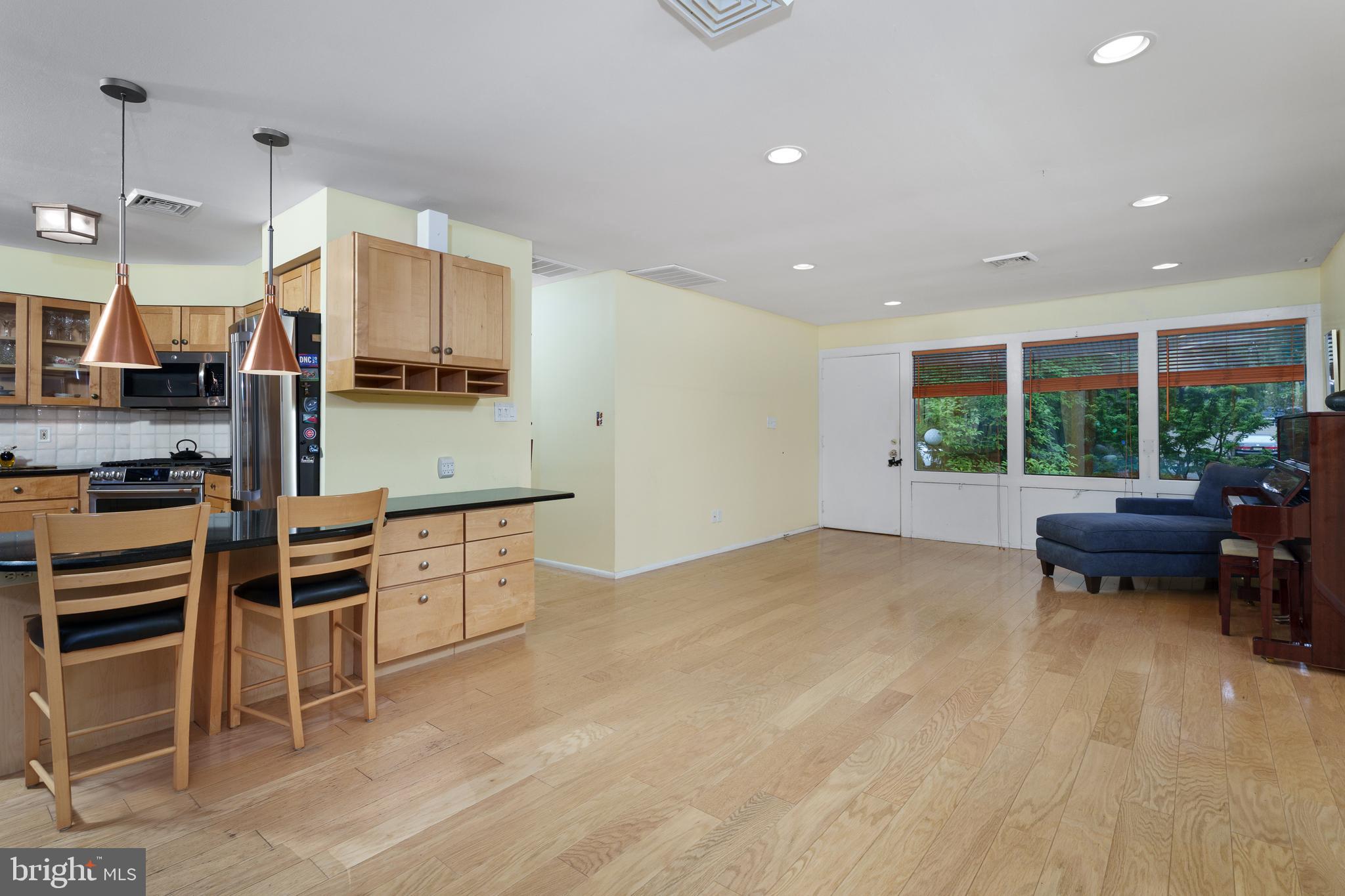 84 Cuyler Road Princeton, NJ 08540 - Photo 5 of 25 a kitchen with stainless steel appliances kitchen island granite countertop a stove and a sink
