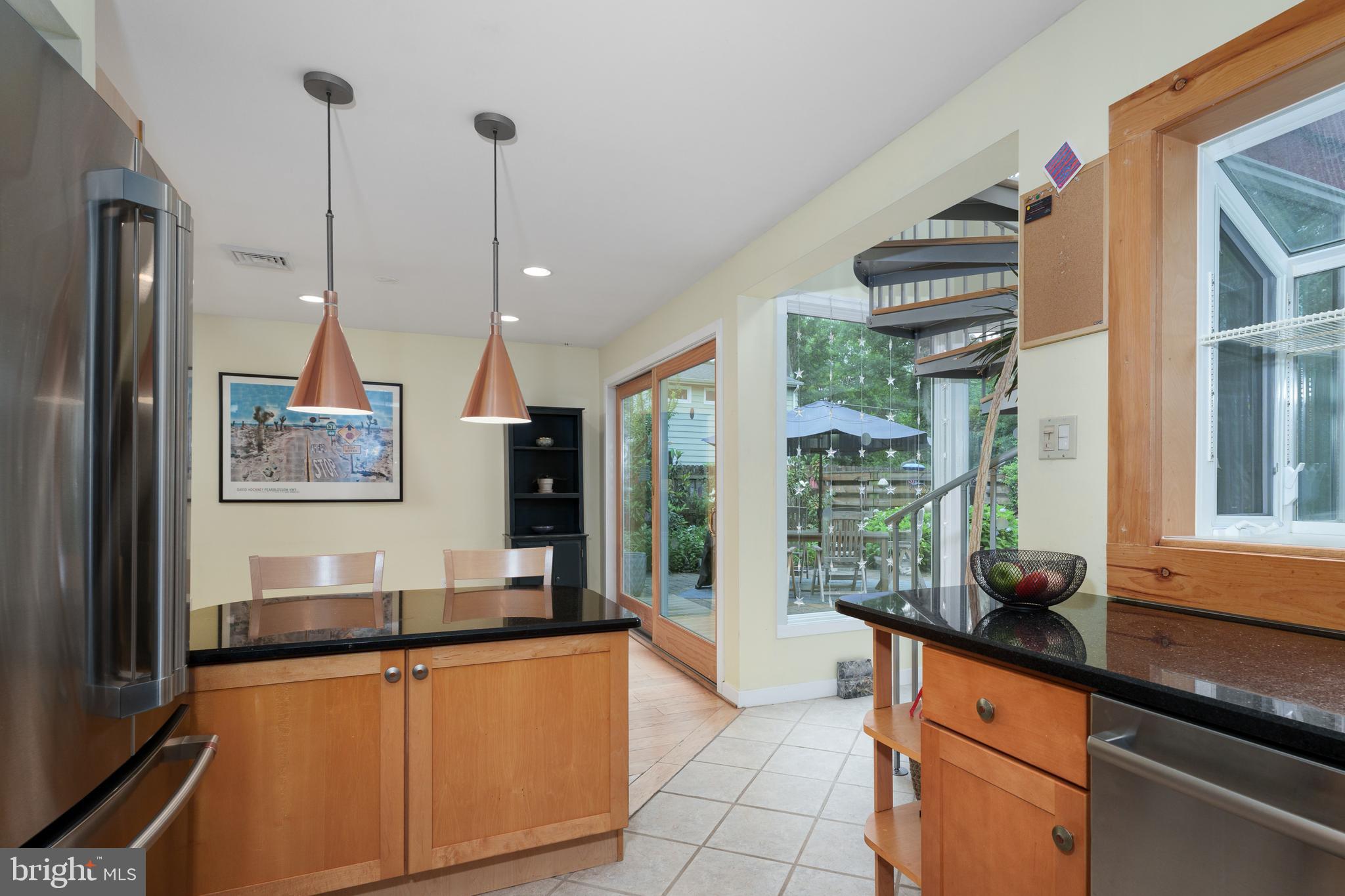 84 Cuyler Road Princeton, NJ 08540 - Photo 10 of 25 a kitchen with stainless steel appliances granite countertop a stove a sink and a refrigerator