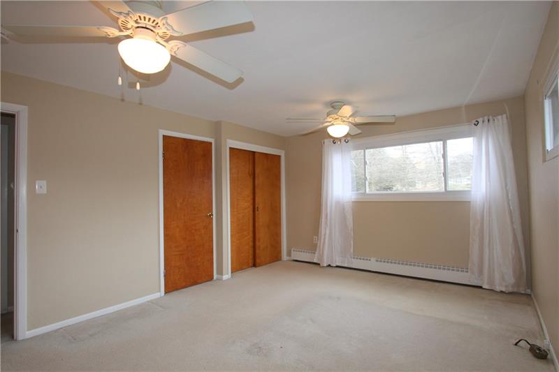 164 Oak Ridge Drive Butler, PA 16002 - Photo 12 of 25 This is a second view of the Master Bedroom showing off the dual ceiling fan lights.