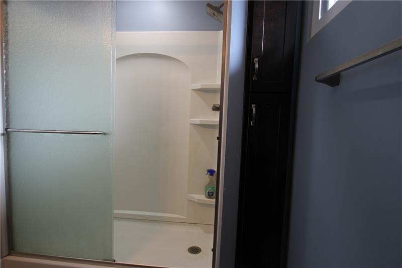 164 Oak Ridge Drive Butler, PA 16002 - Photo 14 of 25 The shower is a walk in and to the right is the floor to ceiling two door storage cabinet.
