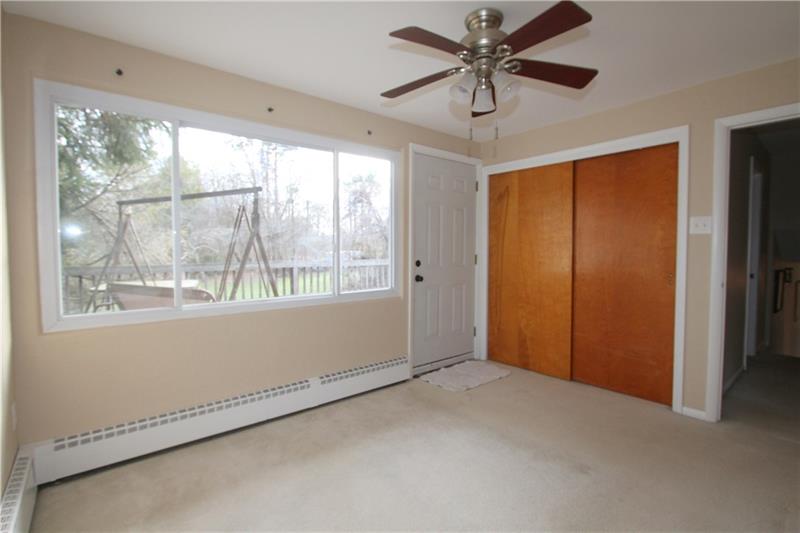 164 Oak Ridge Drive Butler, PA 16002 - Photo 15 of 25 Bedroom #2 is fantastic s it has a walk out door to a large upper deck with a stairwell down to the back yard. I would make this my home office!!