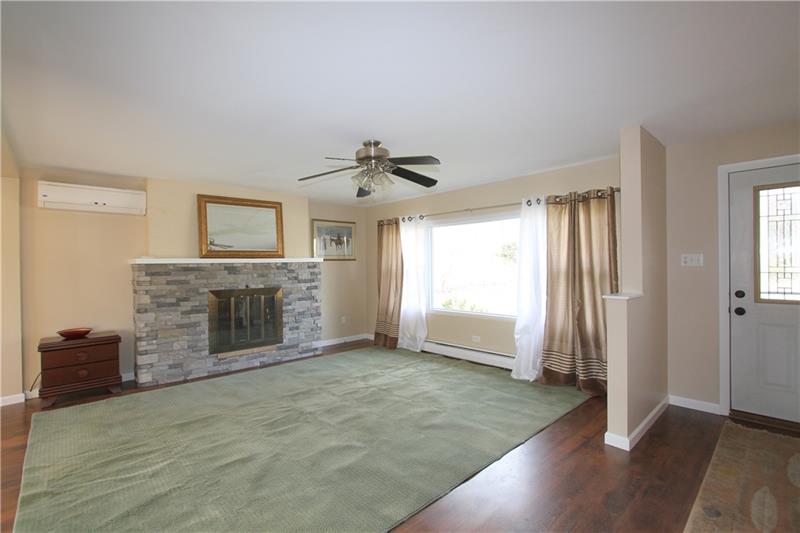 164 Oak Ridge Drive Butler, PA 16002 - Photo 5 of 25 The focal point of this lovely Living Room is the Pennsylvania blue stone gas fireplace.