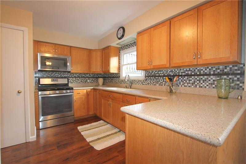 164 Oak Ridge Drive Butler, PA 16002 - Photo 7 of 25 This adorable Kitchen was totally redone in 2015 with glass and ceramic backslash and Corian countertops.